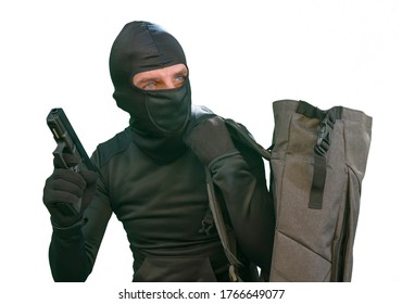 Portrait Of Man In Balaclava Mask Holding Gun In Front Of Security Metal Vault Door In Bank Or Casino Heist Concept Isolated On White Background