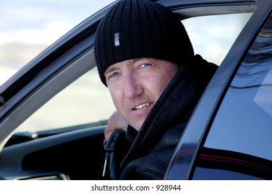 Portrait of the man behind a rudder of the car â€¦