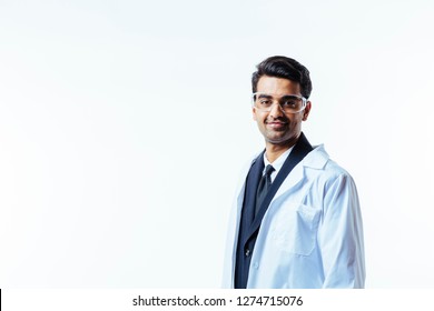 Portrait of a man in business suit, lab coat and protective glasses, looking at camera, isolated on white studio background