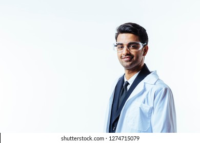Portrait of a man in business suit, lab coat and protective glasses, looking at camera, isolated on white studio background