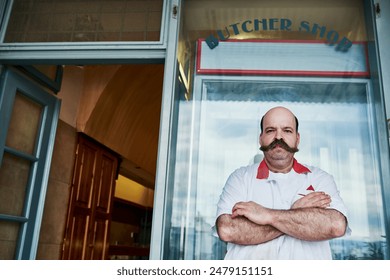 Portrait, man and butcher at shop with arms crossed at small business startup. Worker, confidence and meat seller at retail store with face for pride of professional owner outdoor at market in London - Powered by Shutterstock