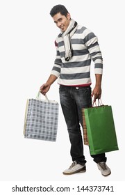 Portrait Of A Man Carrying Shopping Bags