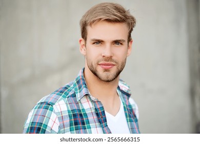 Portrait of man in casual style shirt. Stylish face portrait of unshaven guy. Handsome young man outdoor. Millennial man wearing checkered shirt. Casual style of millennial man - Powered by Shutterstock