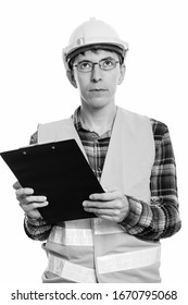 Portrait Of Man Construction Worker Thinking While Holding Clipboard