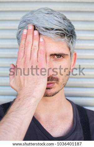 Similar – Man with gray hair and yellow turban.