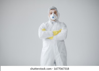 Portrait Of Man Doctor In Protective Clothes During Coronavirus Pandemic. Epidemic, Pandemic Of Coronavirus Covid 19. Doctor, Patient In Respirator.