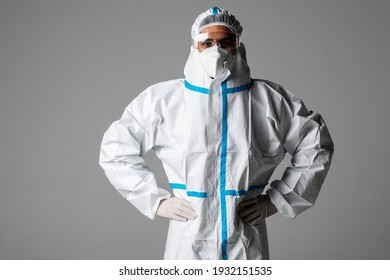 Portrait Of Man Doctor Wearing Googles, Protective Glasses In Protection Suit, Face Surgical Mask On White Background.