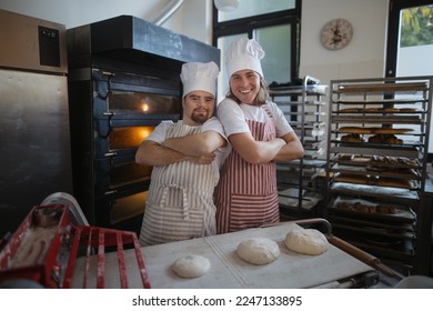 Portrait of man with down syndrom and his colleague in bakery. Concept of integration people with disability into society. - Powered by Shutterstock