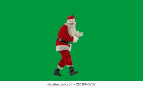 Portrait of man dressed as Santa on chroma key green screen background. Santa Claus in red suit dancing funny. - Powered by Shutterstock