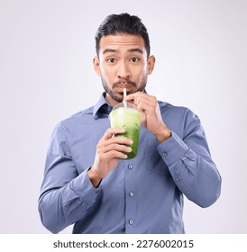 Portrait of man drinking smoothie isolated on white background diet, detox and healthy breakfast choice. Asian business person with green juice for nutrition, energy protein or vegan drink in studio - Powered by Shutterstock