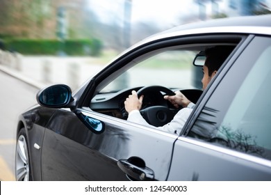 Portrait of a man driving a car