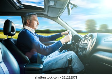 Portrait Of A Man Driving His SUV