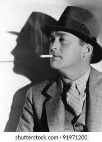 Portrait Of A Man In A Fedora With A Cigarette In His Mouth