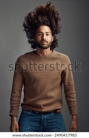 Portrait, man and floating for dream in studio with growth maintenance, weightless sensation and grooming beauty. Male person, levitation and imagination for cosmetic wellness on grey background
