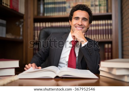 Portrait of a man in front of a book