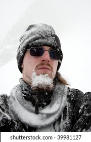 Portrait Of A Man With Frozen Beard In Winter