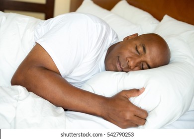 Portrait of a man getting a good nights sleep.