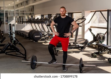 Portrait Of Man In Gym Trainer And Coach. Portrait Of Handsome Successful Gym Owner And Trainer In Gym