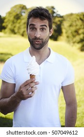 Portrait Of Man Holding Ice Cream