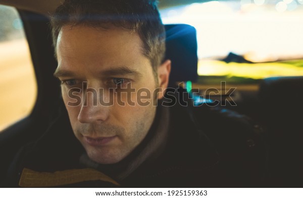 Portrait of a man inside the\
car.