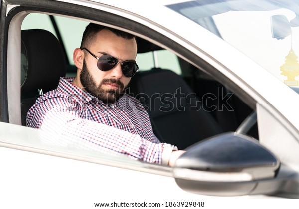 Portrait of a Man\
Learning to Drive a\
Car