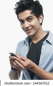 Portrait of a man listening to music on iPod
