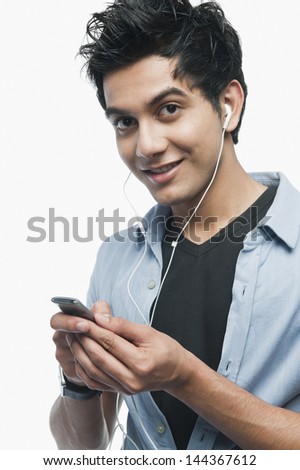 Portrait of a man listening to music on iPod