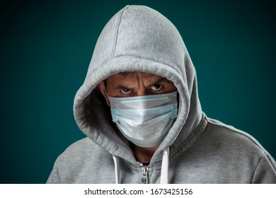 A portrait of man with medical face mask. People, medicine and healthcare concept. Coronavirus protection