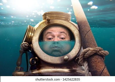 Portrait of man in old diving suit and helmet under water. Funny diver in retro equipment with water inside his helmet .