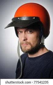 Portrait Of A Man In A Old Motorcycle Helmet