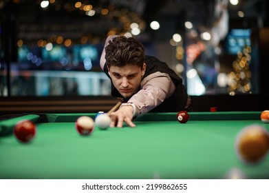 Portrait of man playing billiard - Shutterstock ID 2199862655