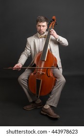 Portrait Of A Man Playing The Viola Da Gamba