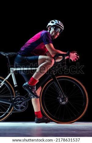 Similar – Man on bicycle preparing for triathlon race