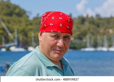 Portrait Man In Red Bandana Against The Backdrop Of Marina Marmaris