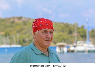 Portrait Man In Red Bandana Against The Backdrop Of Marina Marmaris