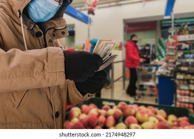 Portrait Of Man In Safety Medical Mask Holding Big Cash Money Pack, Elderly People During A Pandemic