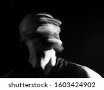 Portrait of a  man screaming in soft focus and long exposure