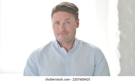Portrait Of Man Shaking Head As No Sign