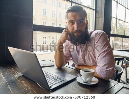 Portrait of a man sitting in front of the computer