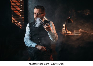 Portrait of man sitting on chair and smoking pipe - Powered by Shutterstock