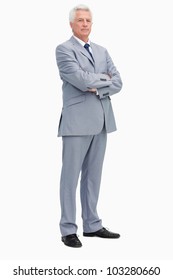 Portrait Of A Man In A Suit With Folded Arms Against White Background