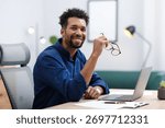 Portrait of man at table in office
