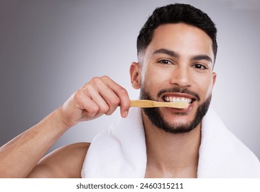 Portrait, man or toothbrush for dental hygiene, wellness or cleaning on white studio background. Face, person or model with teeth whitening, grooming routine or oral health with care or remove plaque - Powered by Shutterstock