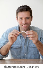 Portrait Of Man Trying To Quit Smoking