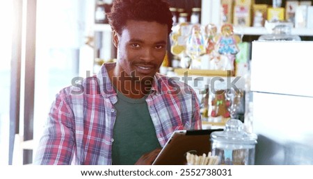 Portrait of man using digital tablet in cafÃ© 4k