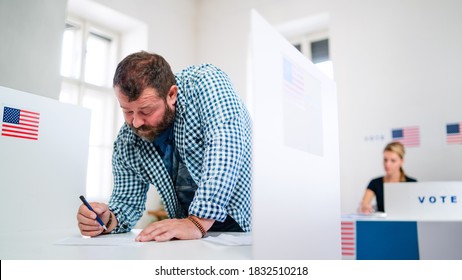 Portrait Of Man Voter In Polling Place, Usa Elections Concept.