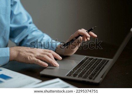 portrait of a man
Working on tablet computer in modern office make account analysis report Real estate investment information, financial and tax system concept