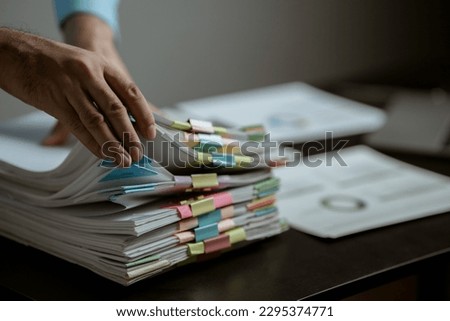 portrait of a man
Working on tablet computer in modern office make account analysis report Real estate investment information, financial and tax system concept