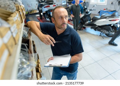 Portrait Of Manager Of A Motorcyclist In Store