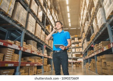 Portrait Of Manager In Warehouse. Wholesale, Logistic, People And Export Concept . Business Owner Using Tablet Computer In Distribution Warehouse.